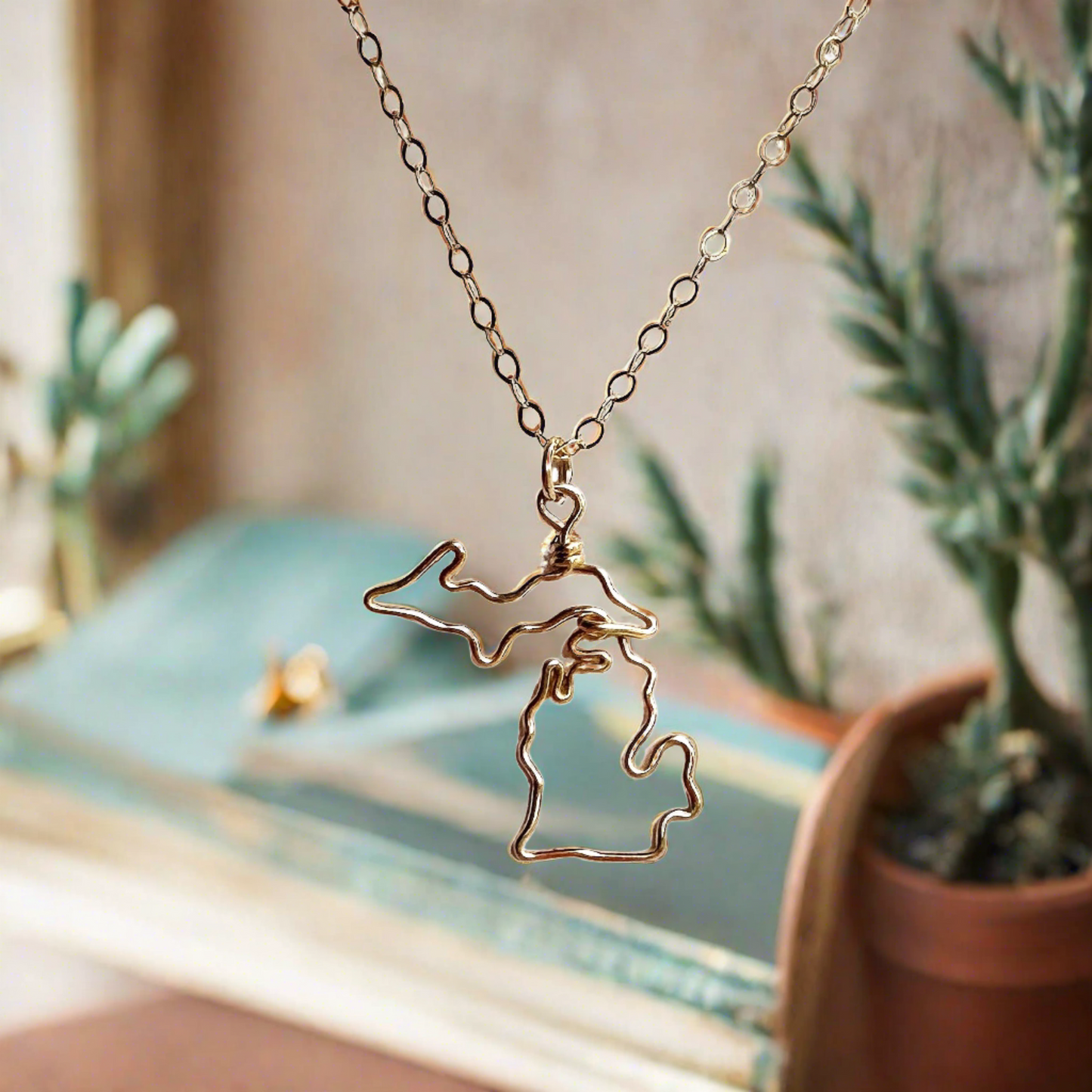 gold outline Michigan necklace with mitten and UP