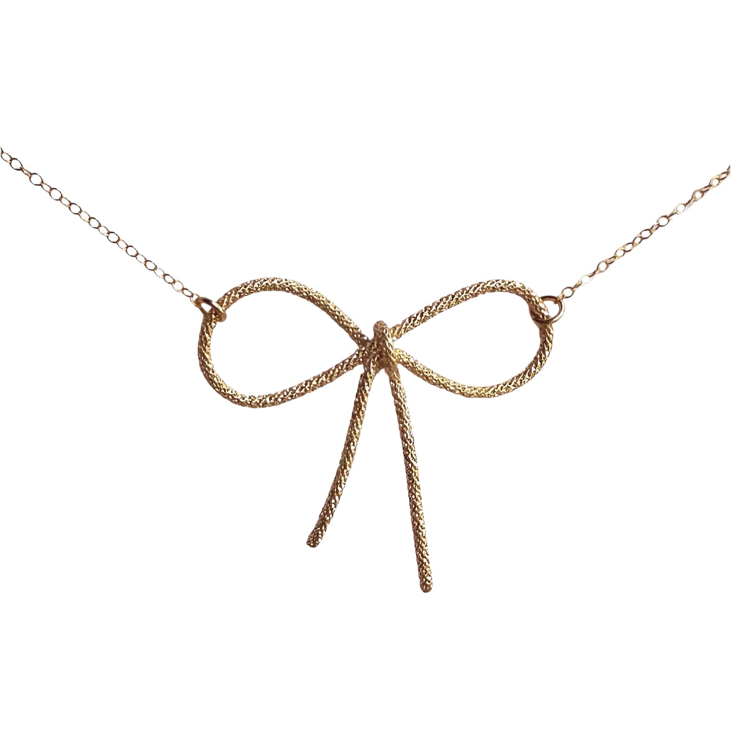 gold sparkle wire bow pendant necklace wire tied into a bow 2 inches across with dainty gold chain connecting onto each loop of the ribbon/bow