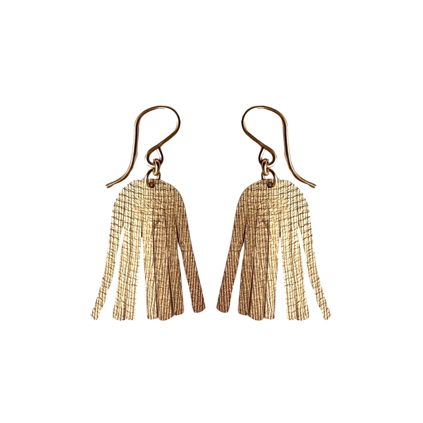 gold shimmering dangle earrings on white background