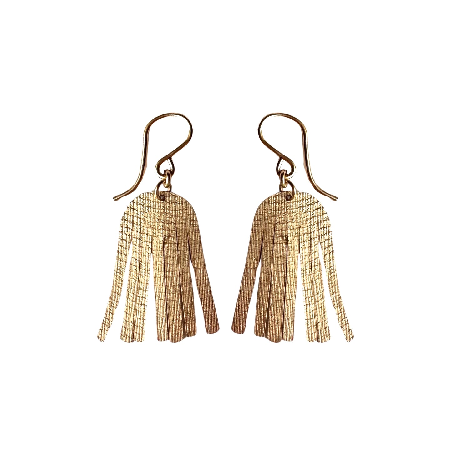 gold shimmering dangle earrings on white background