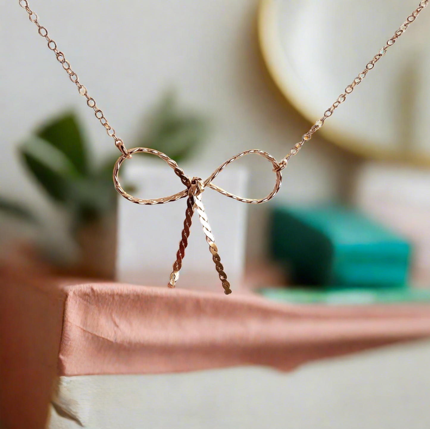 Twisted Bow Pendant Necklace