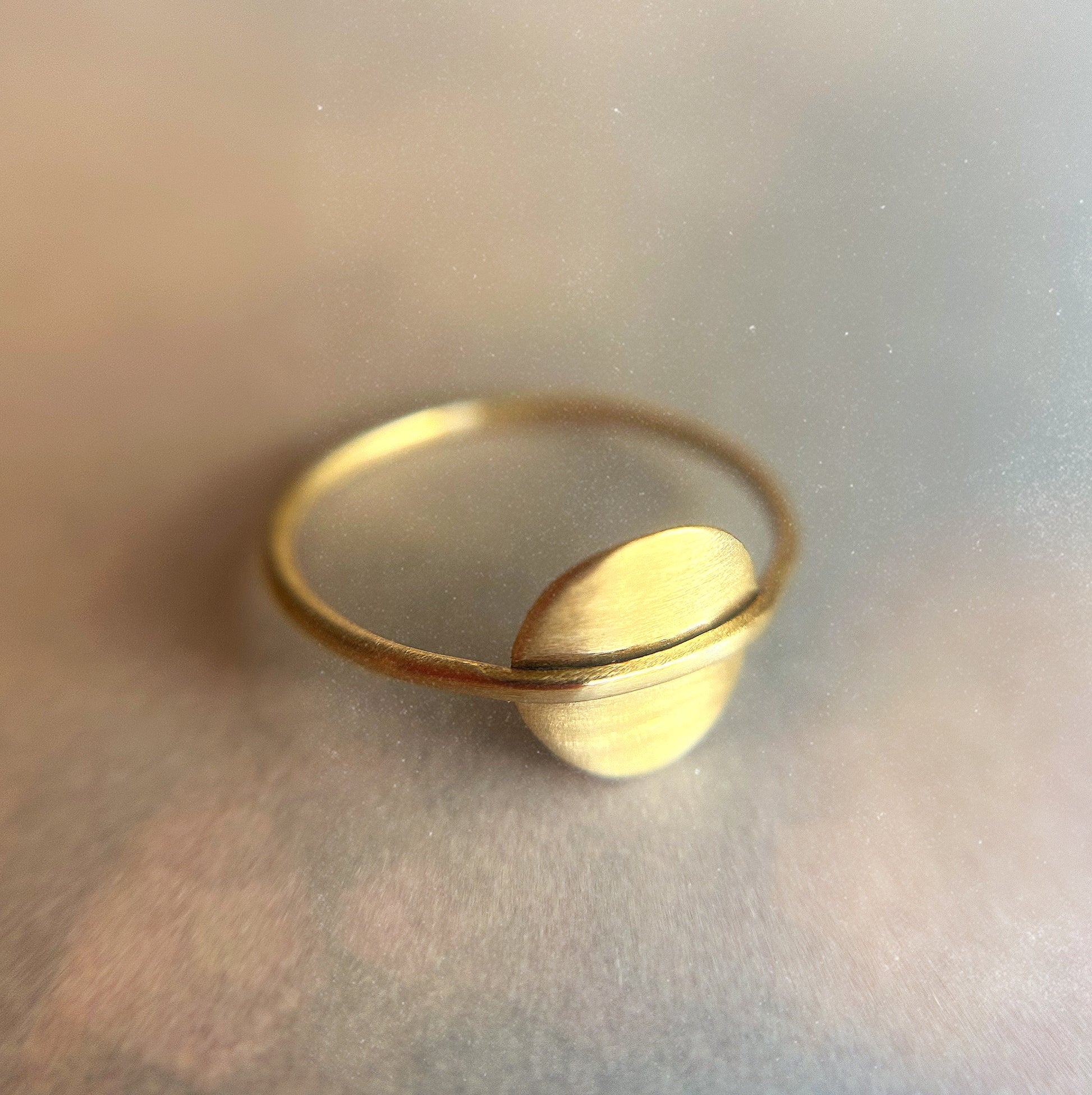 gold circle ring on textured cosmos background
