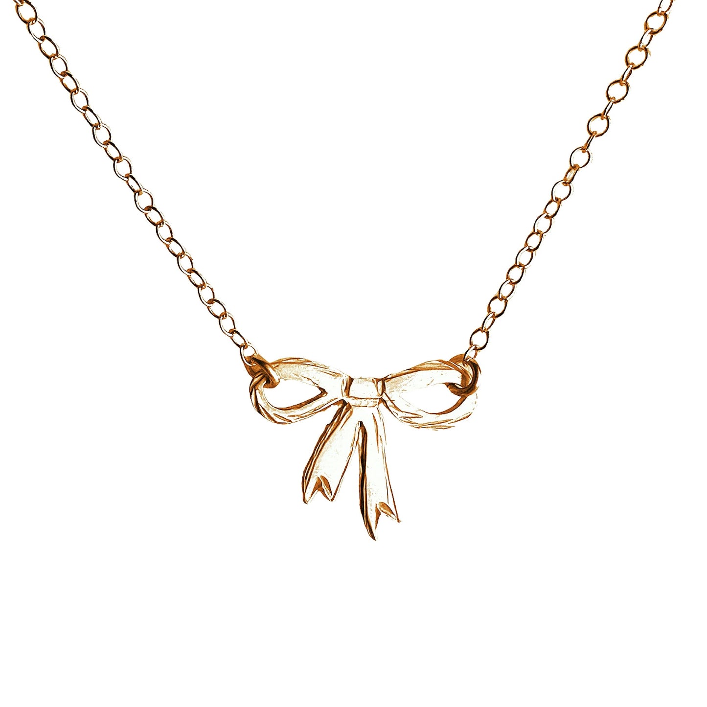 trendy gold bow necklace on white background