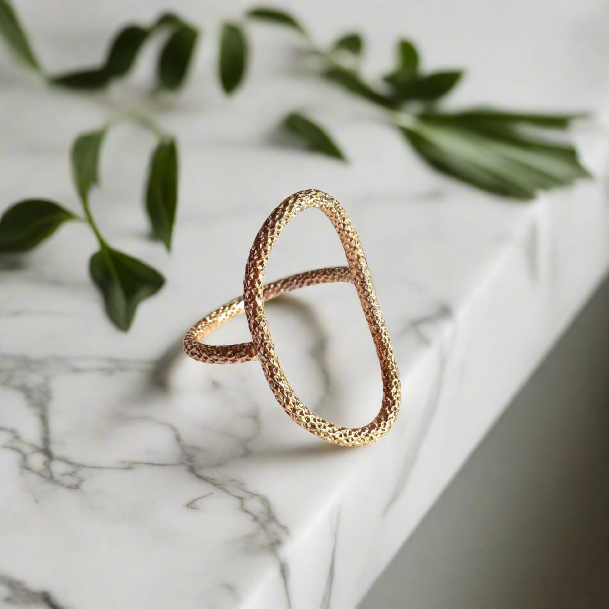 gold oval ring with sparkly texture on an AI generated background